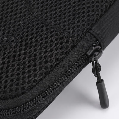 Macro closeup of mesh fabric and zipper pull detail