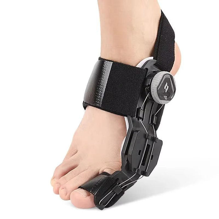Black bunion toe splint worn on foot with BOA dial