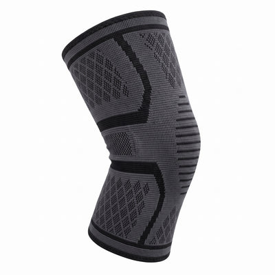 Gray compression knee sleeve shown at three-quarter angle