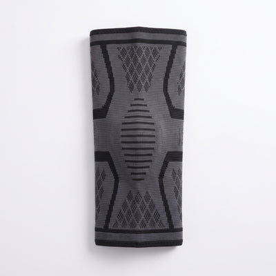Compression knee sleeve laid flat showing full length