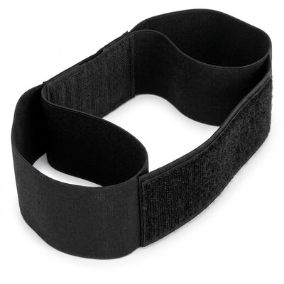 Black elastic golf swing training arm band on white background