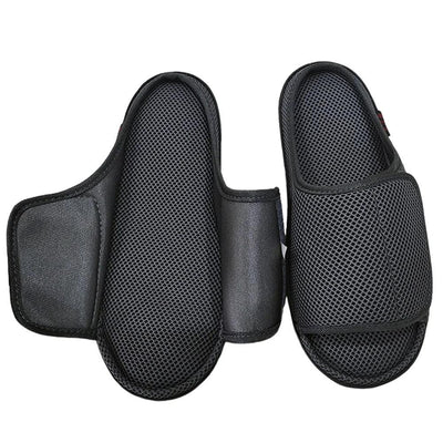 Black slipper pair with strap fully unfastened flat