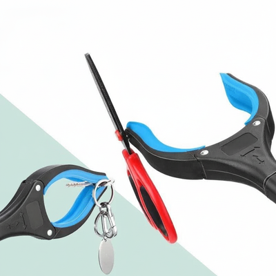 Close-up of grabber jaw retrieving a set of keys