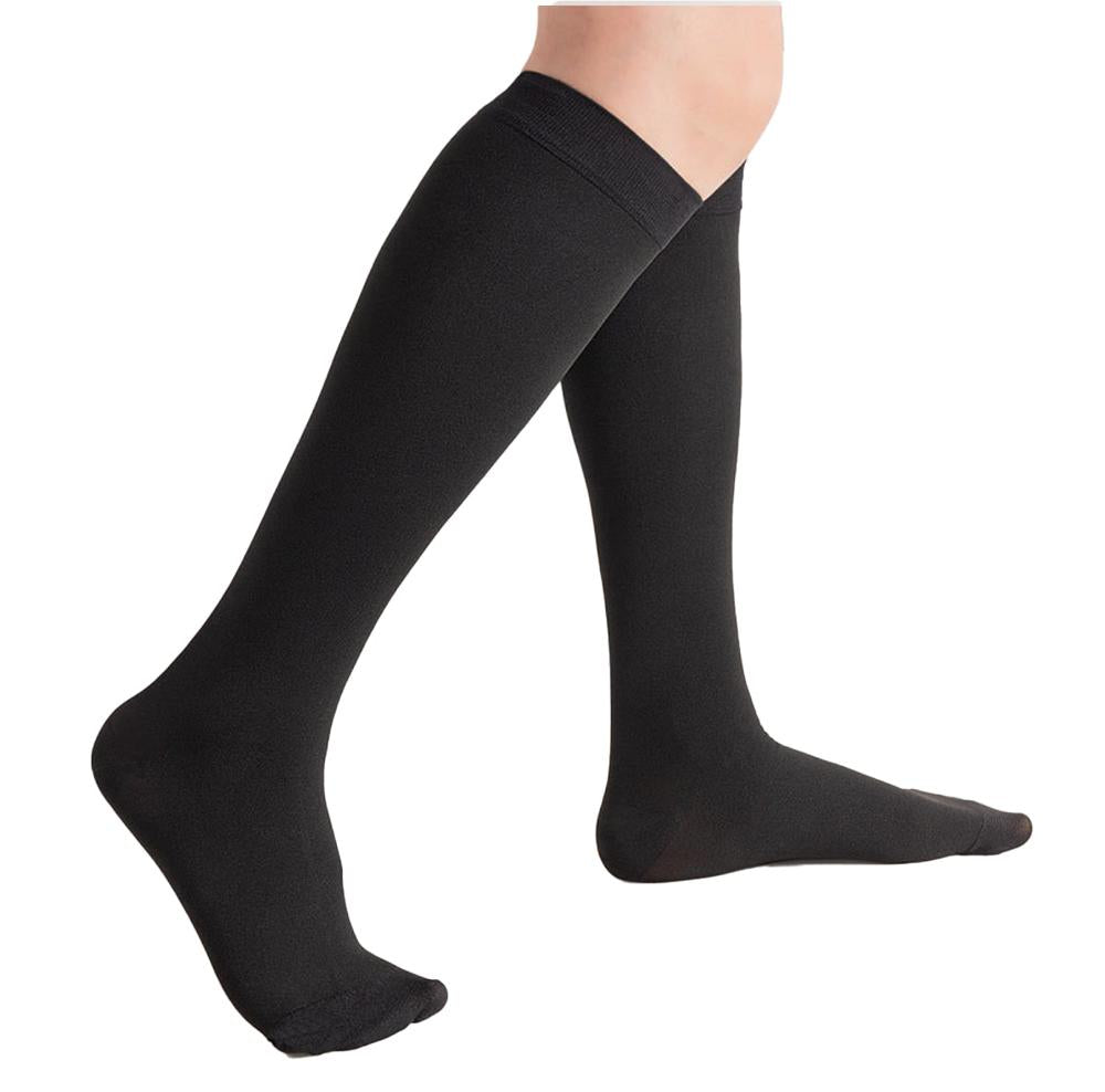 Black knee-high compression stocking on lower leg and foot