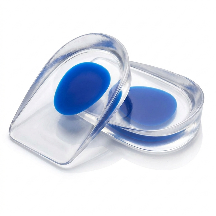 Pair of transparent silicone gel heel cups on white background