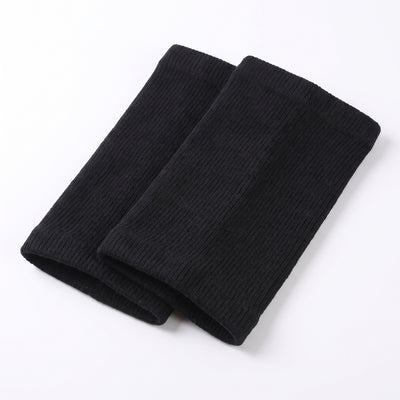 Folded pair of black ribbed knit knee warmer sleeves