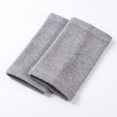 Folded pair of gray ribbed knit knee warmer sleeves