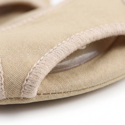 Close-up of stitched fabric edge and gel cushion inside pad