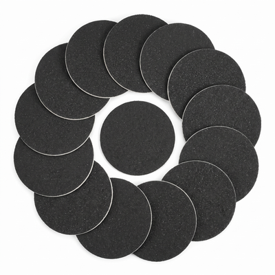 Top-down flat lay of sandpaper foot file refill discs