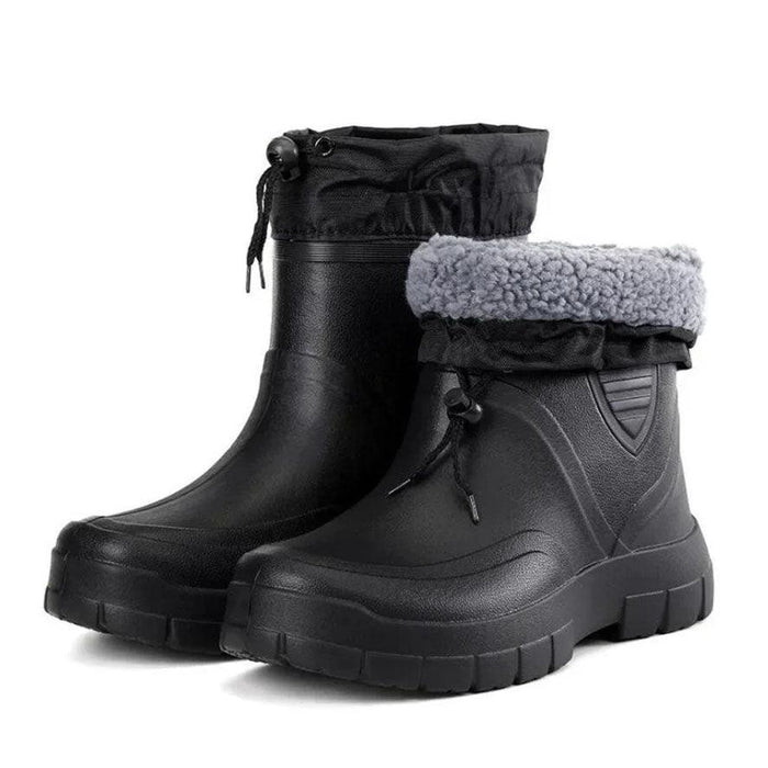 Black waterproof winter boot pair on white background