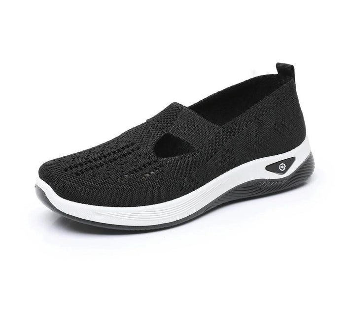Black breathable slip-on walking shoe, side view