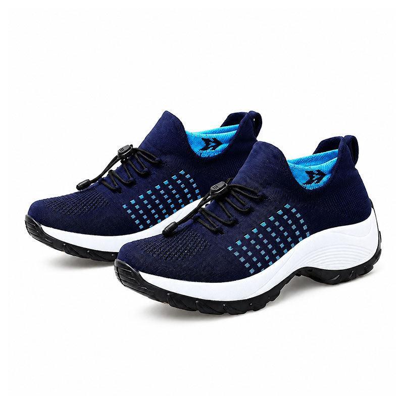 Blue cushioned walking shoes pair on white background