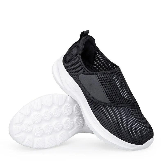 White and black mesh slip-on shoe pair with white sole
