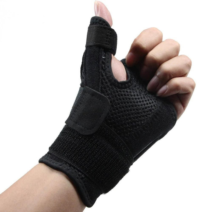 Black wrist and thumb support brace on hand