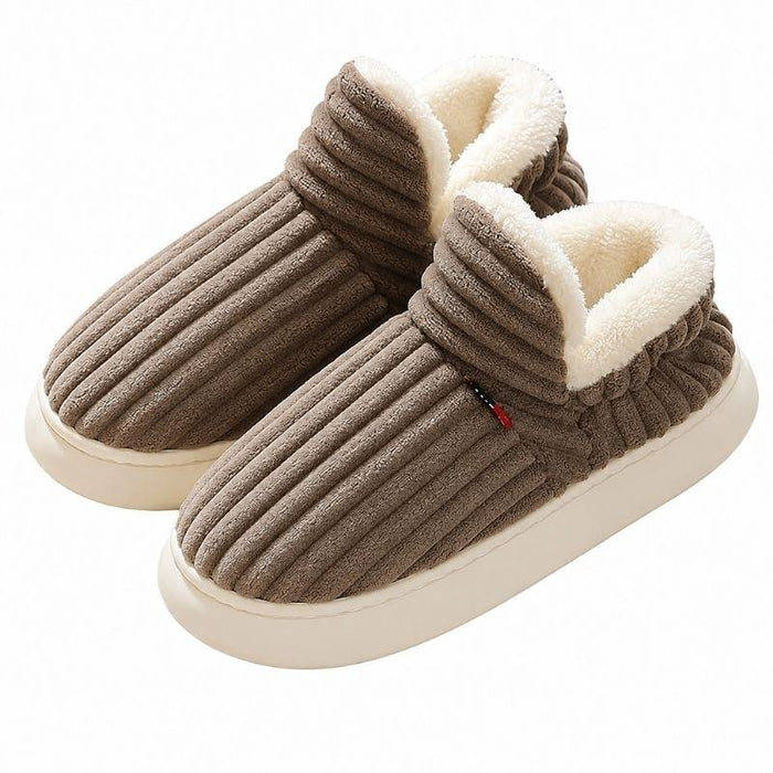 Brown plush-lined corduroy slippers on white background