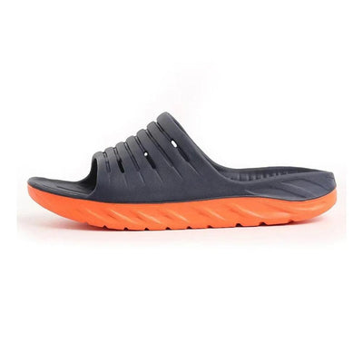 Navy blue slide slipper with orange sole
