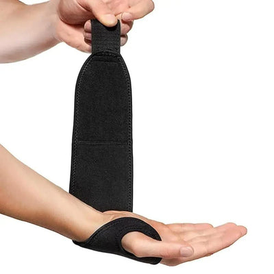 Hands adjusting wrist wrap strap before securing it