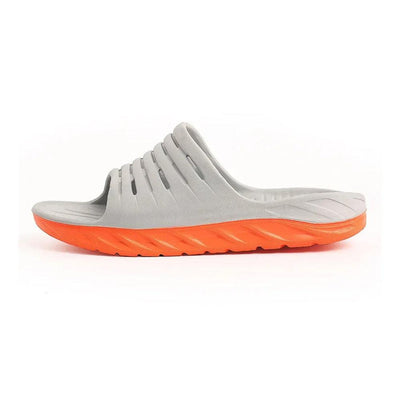 Gray slide slipper with orange cushioned sole