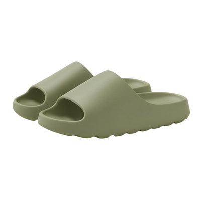 Green EVA slide slippers pair on white background