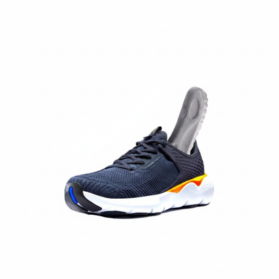 Gray insole being placed inside blue athletic sneaker