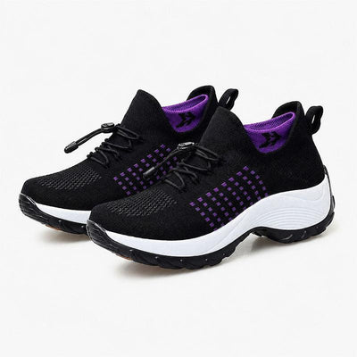 Black walking shoes with purple accents on white background
