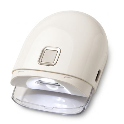 Electric nail clipper with LED light on white background