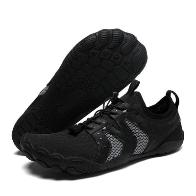 Black water shoes displaying grippy barefoot-style outsole