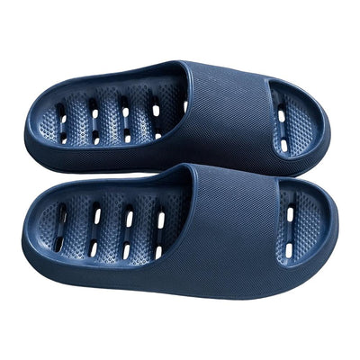 Navy blue EVA shower slides with drainage holes, top view