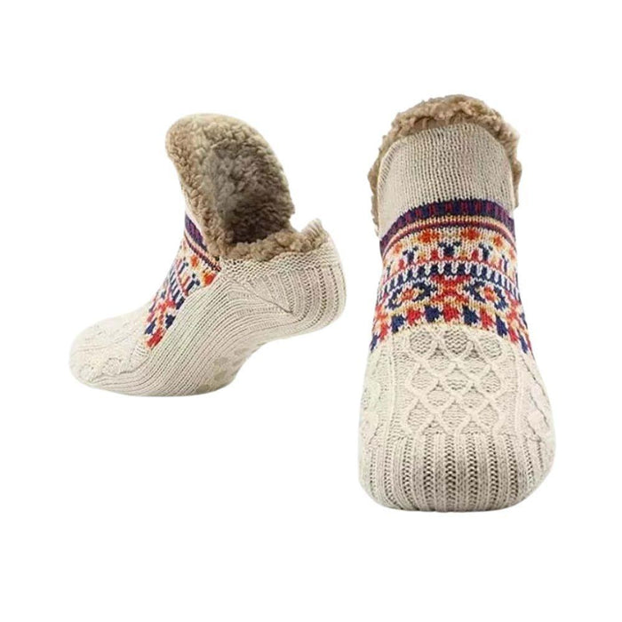 White fleece-lined slipper socks with Nordic pattern on white background