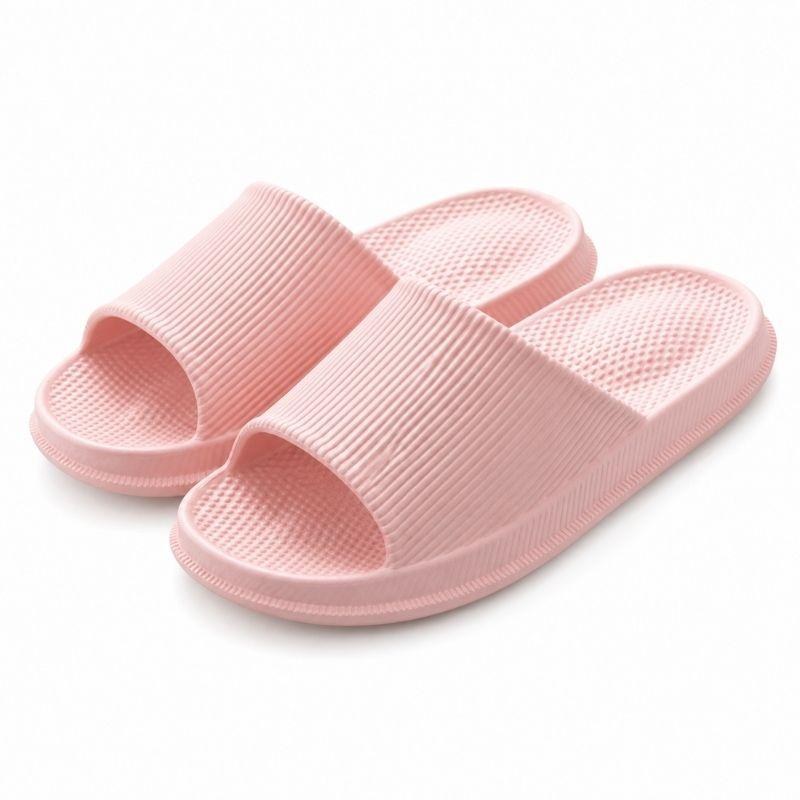 Pink cushioned heel slippers pair on white background
